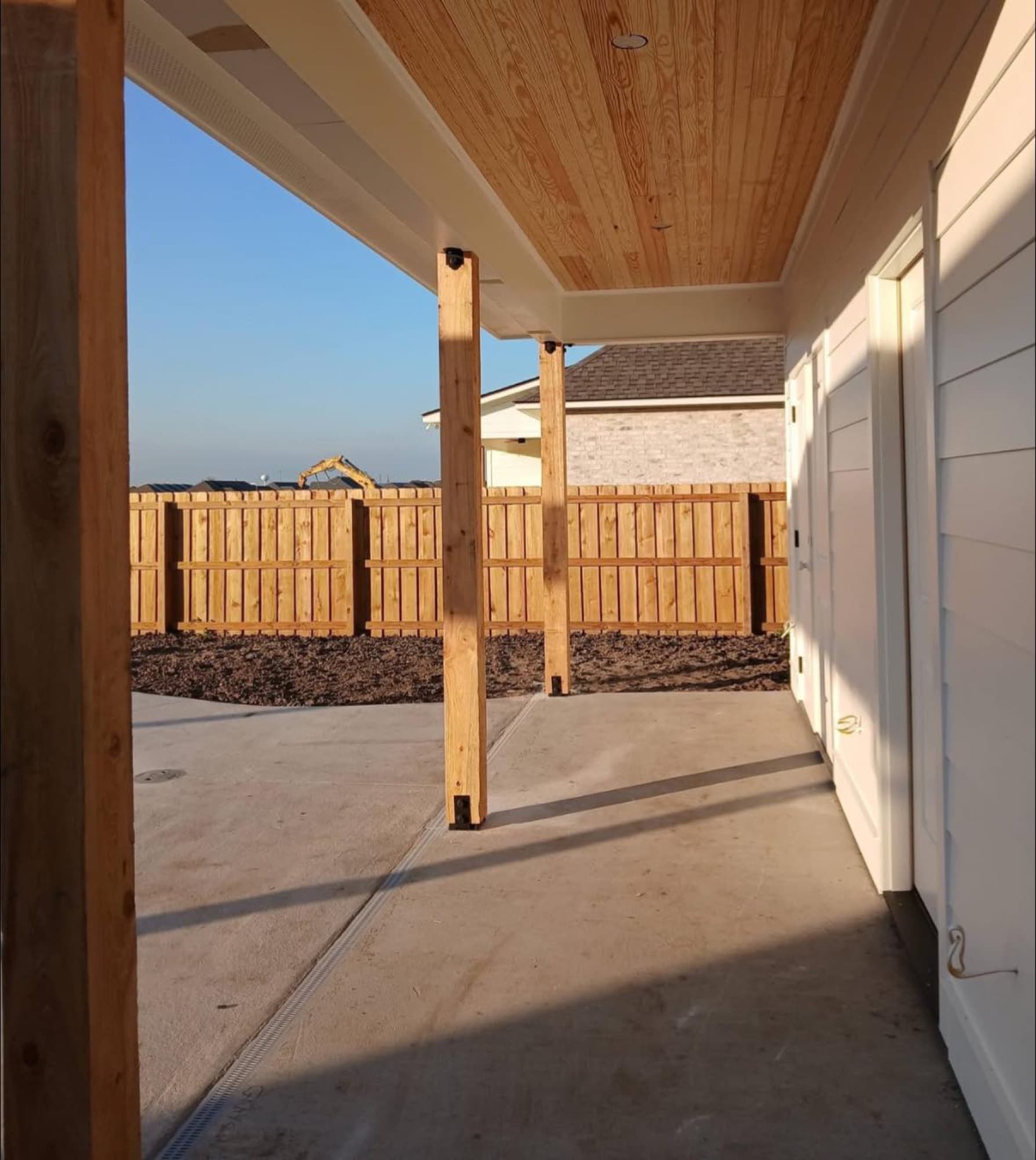 Covered patio addition with wood-plank ceiling — Lafourche Parish