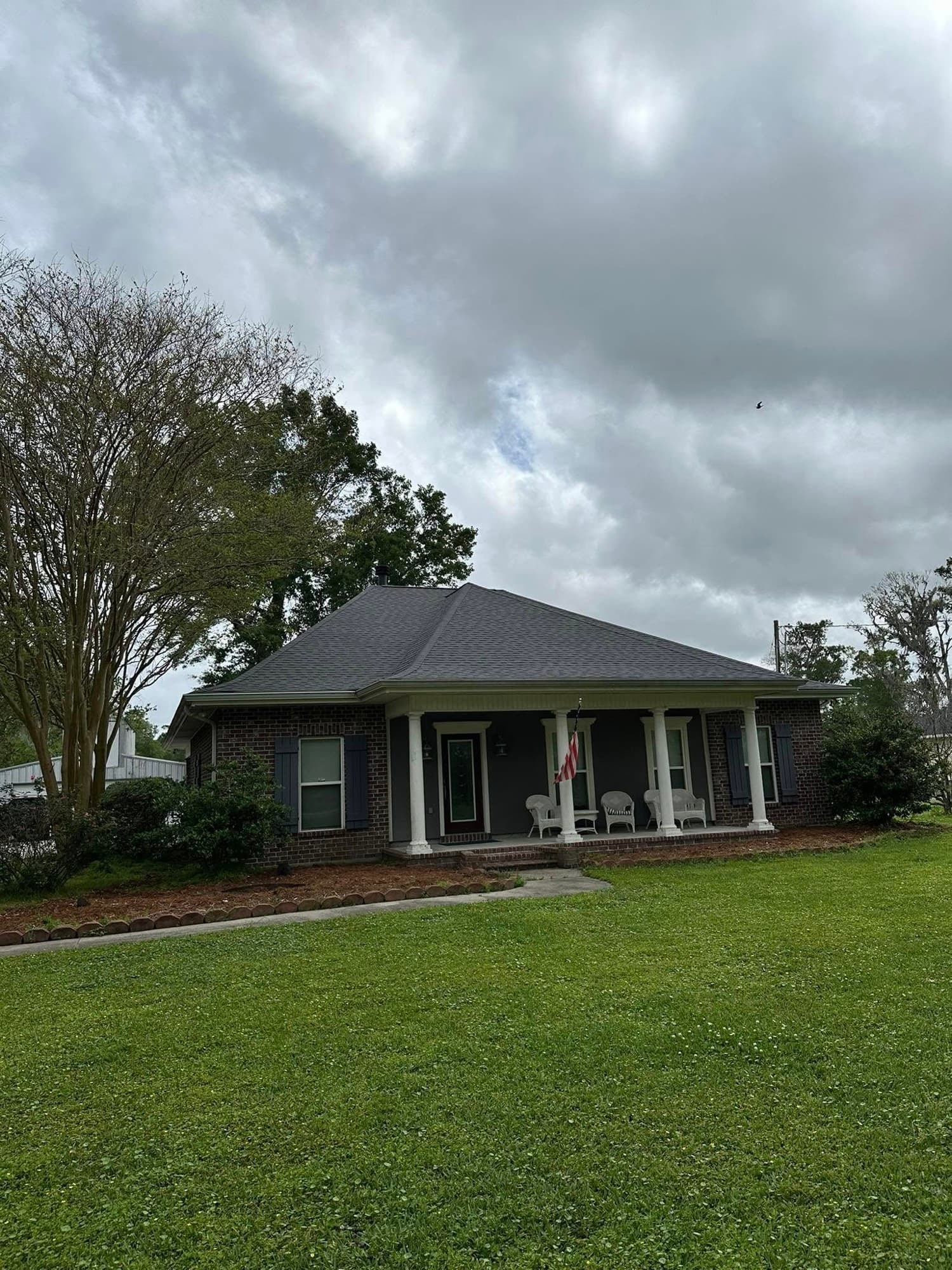 Brick cottage-style home with covered front porch — Lafourche Parish