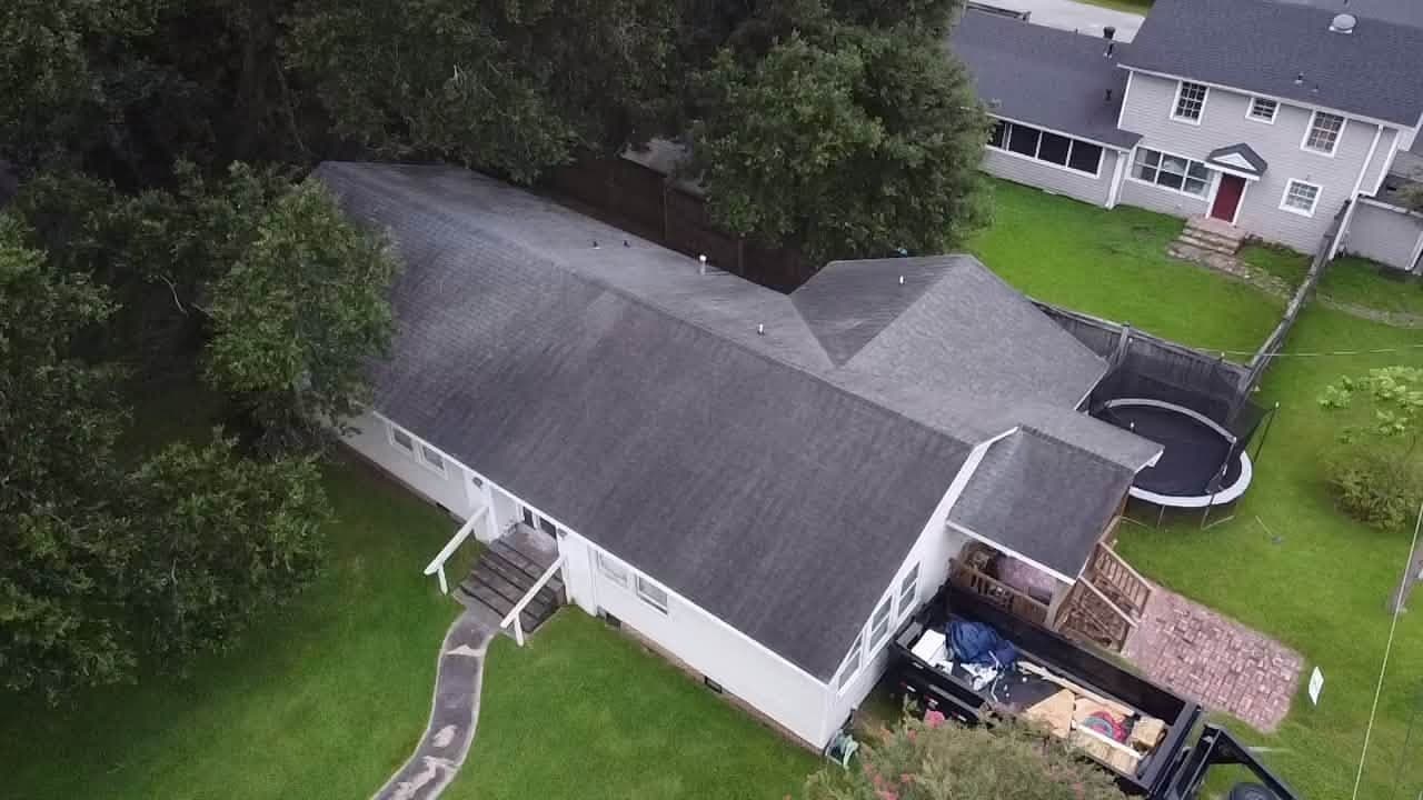 Drone view of a completed architectural shingle roof replacement by Foret Construction — south Louisiana